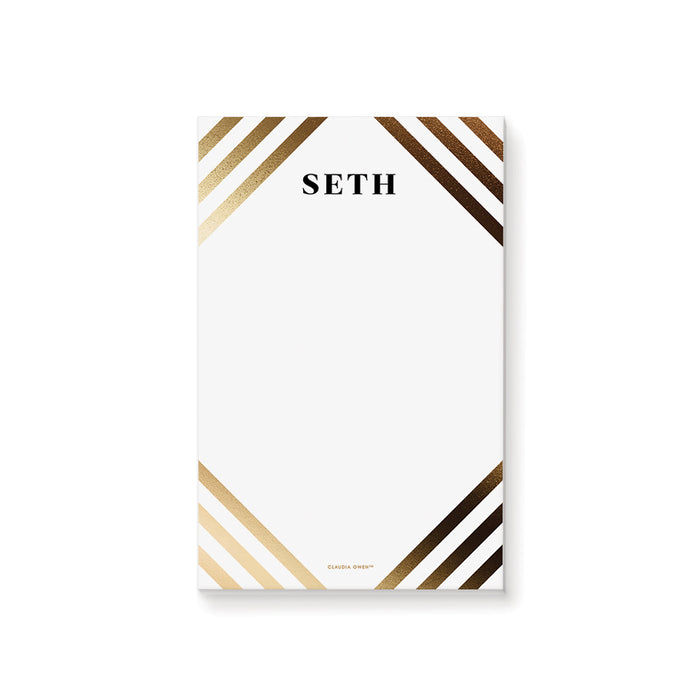 Personalized white notepad with custom name and elegant gold and black diagonal stripe border