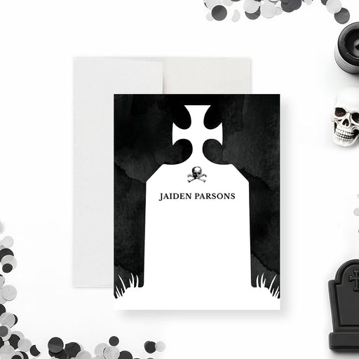 personalized gothic tombstone thank you card with black background, skull and crossbones detail, and custom name-front
