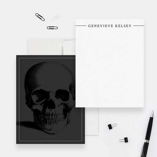 Personalized white note card with a black name header, beside a dark gray back featuring a black skull illustration.