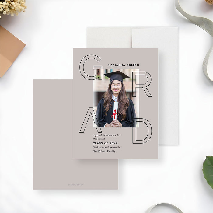 Modern graduation announcement card featuring a photo of the graduate with bold GRAD typography and a personalized message-front-back