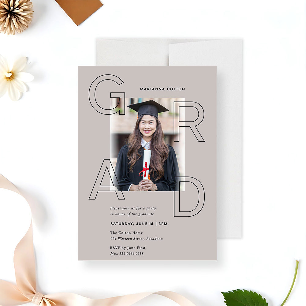 Modern graduation invitation featuring a photo with bold GRAD typography on neutral background-front