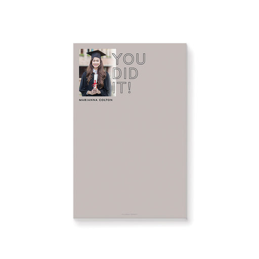 Personalized graduation notepad featuring a graduate photo with “You Did It” text on neutral background