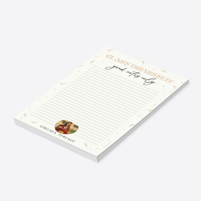 Cream-colored graduation notepad with “Class Dismissed” header, confetti accents, and personalized photo at the bottom-side