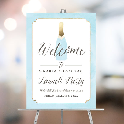 Personalized grand opening welcome sign with blue champagne bottle, pale blue border, business name, launch party wording and event date
