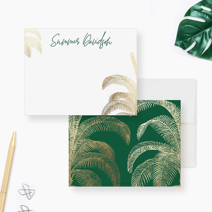Personalized note cards with printed gold palm trees on a white front and green reverse with a gold palm pattern.