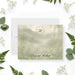 Personalized wedding note card with leafy monogram wreath, Emma and Michael names, misty sage watercolor landscape and delicate wildflowers-front