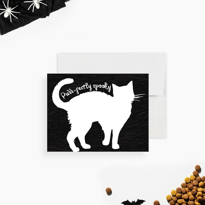 Black and white Halloween cat note card with a large cat-shaped writing area, textured background and Purr-fectly Spooky wording along the tail-front