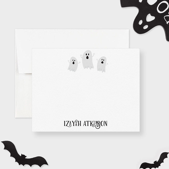 Personalized note card with three friendly ghosts and a personalized name, shown with a white envelope.