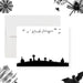 personalized Halloween note card with spooky graveyard silhouette, bats, tombstones, custom name, and blank writing space-front