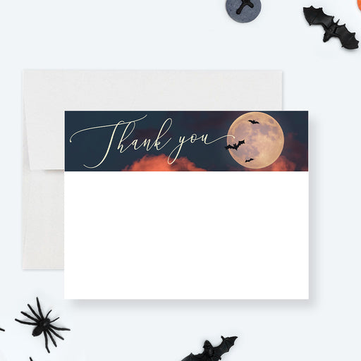 Halloween thank you card with full moon, flying bats, dark orange clouds, and blank space for a handwritten note