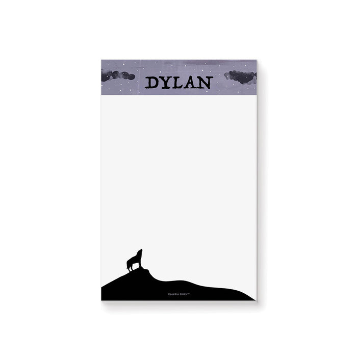 personalized Halloween notepad with howling wolf silhouette, starry purple sky, custom name, and blank writing space
