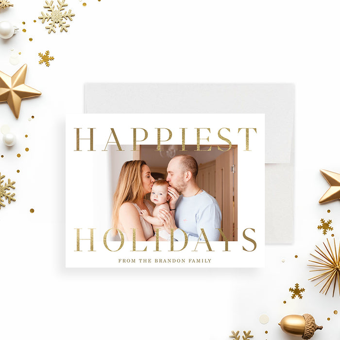 family photo Christmas card with custom photo, Happiest Holidays wording, gold-colored snowflakes, acorns, and personalized family message-front