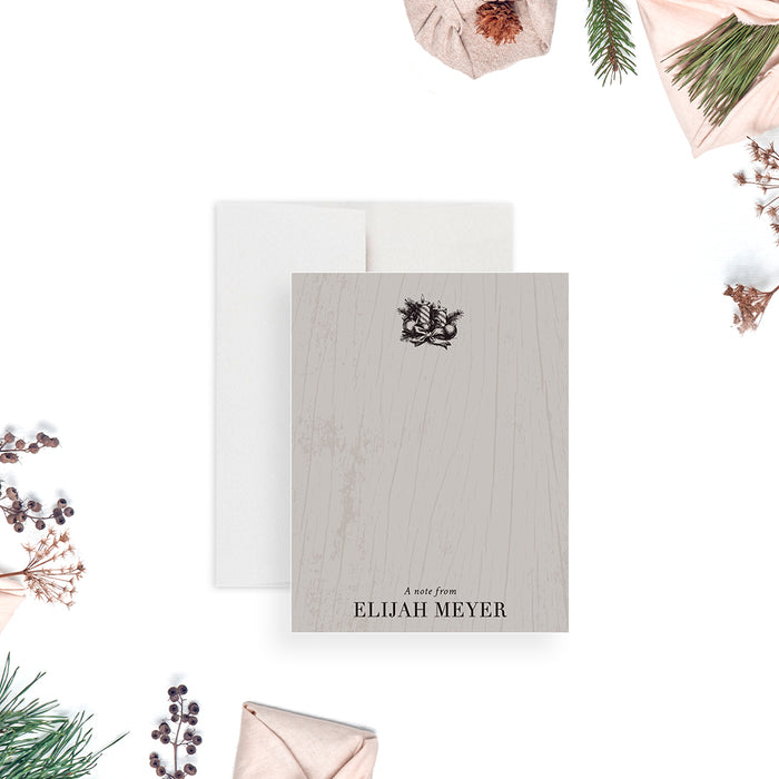 Festive personalized holiday note card featuring a wood-grain background, pine boughs, ornaments, ribbon, and candlelight design.-front