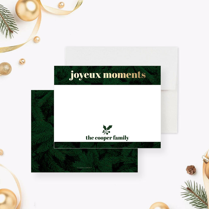 Personalized holiday note card with evergreen foliage borders, gold "joyeux moments" lettering, holly illustration, custom family name and a spacious writing area-front-back