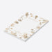 personalized holiday notepad with gold-toned pine branches, pinecones, snowflakes, festive border, and custom family name-side