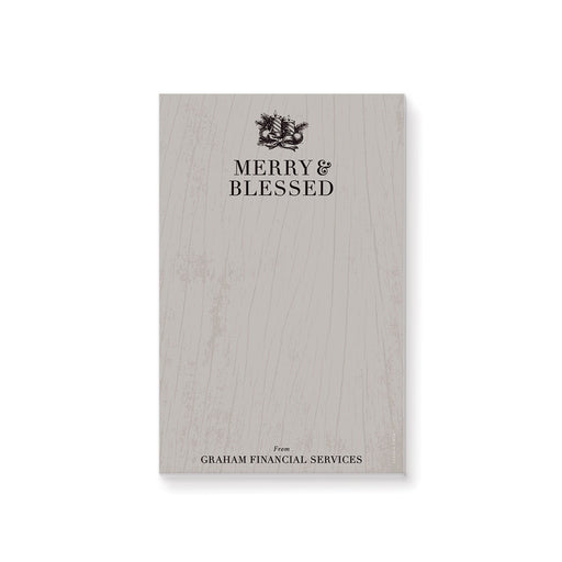 Personalized holiday notepad featuring “Merry and Blessed” text with wood grain, pine boughs, ornaments, ribbon, and candle illustrations. 