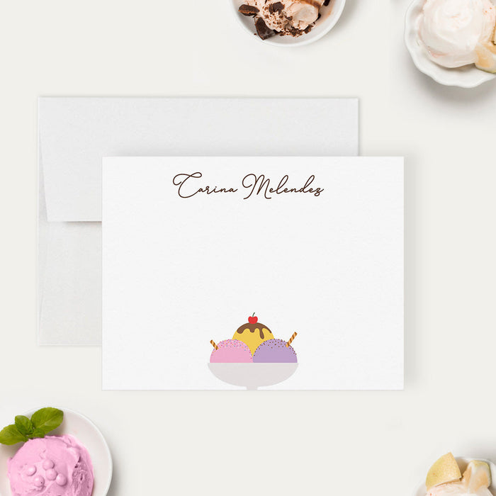 Personalized note card with an ice cream sundae illustration with sprinkles, a cherry and a personalized name, shown with a white envelope.