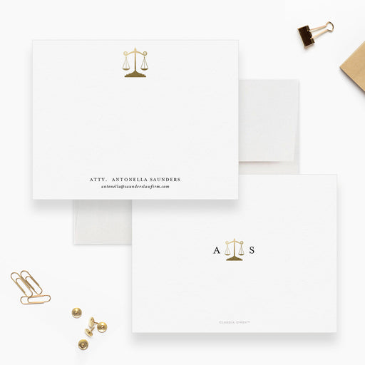 Personalized white lawyer note cards with a gold scales of justice illustration and custom name and contact wording.