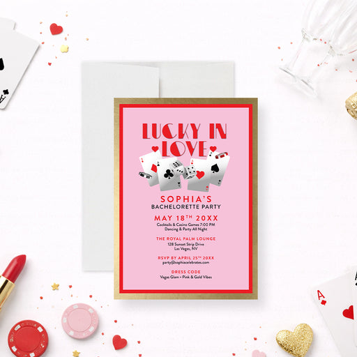 Personalized Lucky in Love casino bachelorette party invitation with pink background, playing cards, dice, custom event details and dress code-front