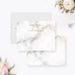 Personalized white and gray marble note cards with a name, monogram and printed gold lines on the front and a marble pattern on the reverse.