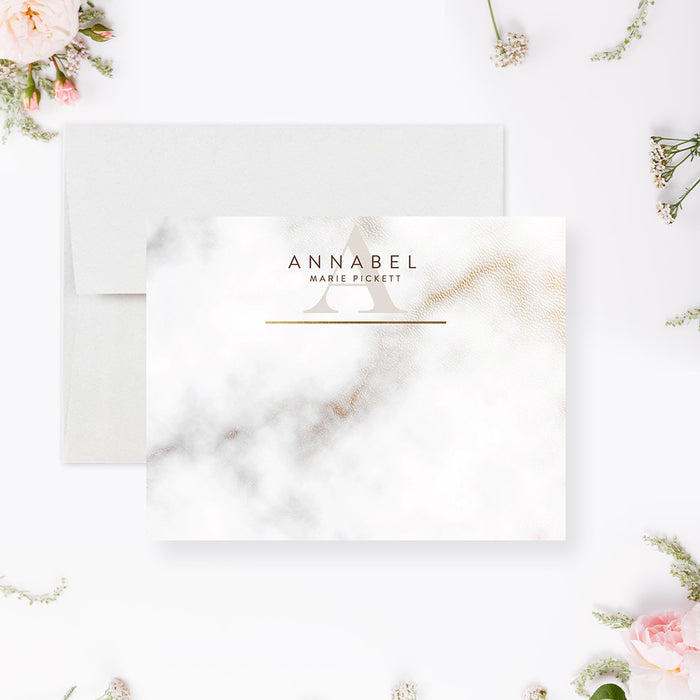 Personalized white and gray marble note cards with a name, monogram and printed gold lines on the front and a marble pattern on the reverse.