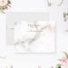 Personalized white and gray marble note cards with a name, monogram and printed gold lines on the front and a marble pattern on the reverse.