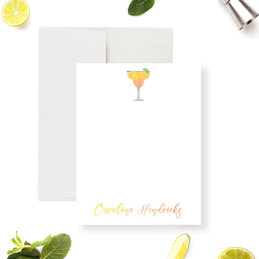 Personalized note card with a white front with a margarita and lime illustration and a name in warm script. Shown with a white envelope.