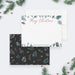 Personalized Merry Christmas note card with red script lettering, watercolor greenery and berries, shown with a white envelope-front-back