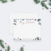 Personalized Merry Christmas note card with red script lettering, watercolor greenery and berries, shown with a white envelope-front