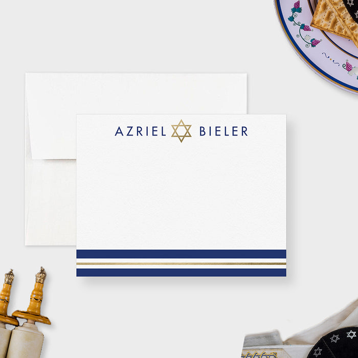 Personalized mitzvah thank you card with a navy name, printed gold Star of David and navy and printed gold stripes on white.