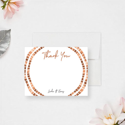Personalized wedding thank you card with Thank You script, couple names, large handwritten message area and circular geometric border in warm copper tones-front