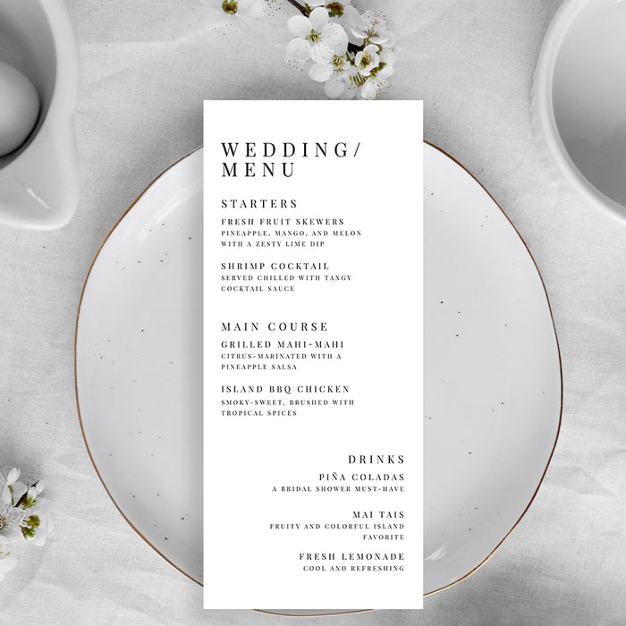 Wedding menu card on a white plate with floral decorations