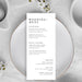 Wedding menu card on a white plate with floral decorations