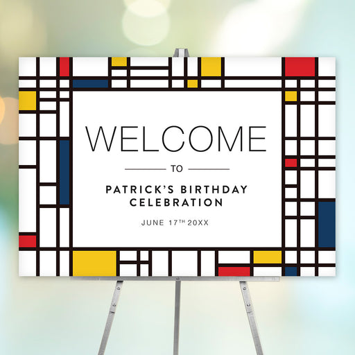 Mondrian-inspired birthday welcome sign with navy, red and yellow geometric artwork, customizable for Patrick's birthday celebration displayed on an easel.