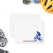 Personalized note card with a blue mountain biker illustration and a personalized name, shown with a white envelope.