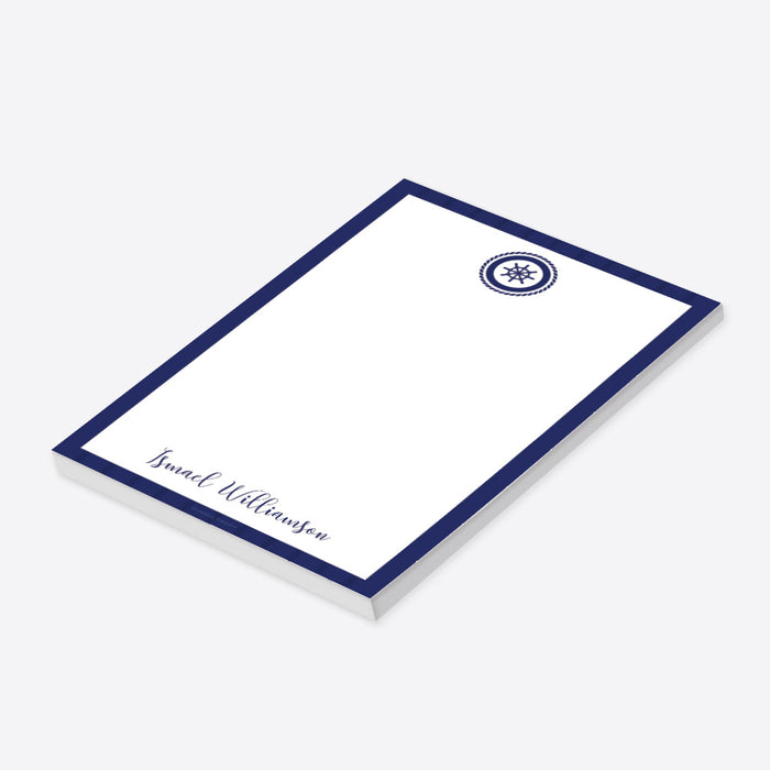 personalized nautical notepad with navy blue border, ship wheel emblem, and custom name for a baby shower gift-side