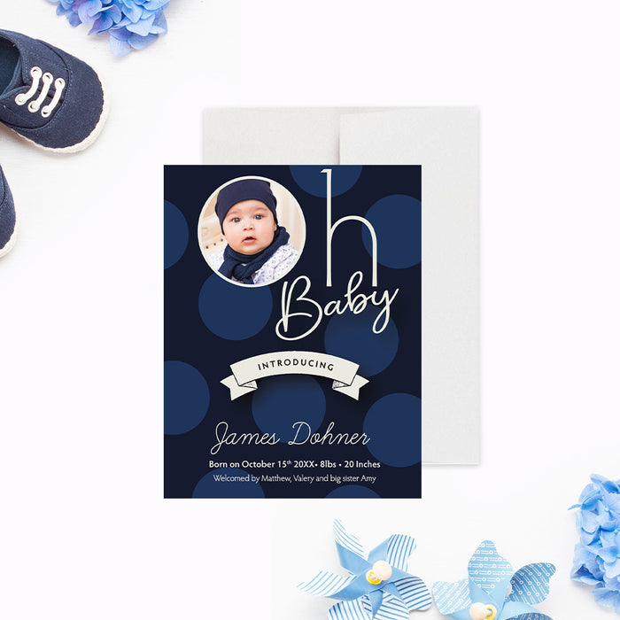Personalized navy blue polka dot baby boy photo birth announcement with circular newborn photo, name, birth date, weight, length and family names-front