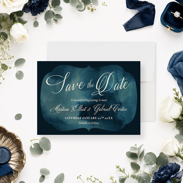 Personalized navy blue watercolor save the date card with elegant white script, couple’s names, wedding date, and details to follow-front