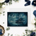 Personalized navy blue watercolor save the date card with elegant white script, couple’s names, wedding date, and details to follow-front
