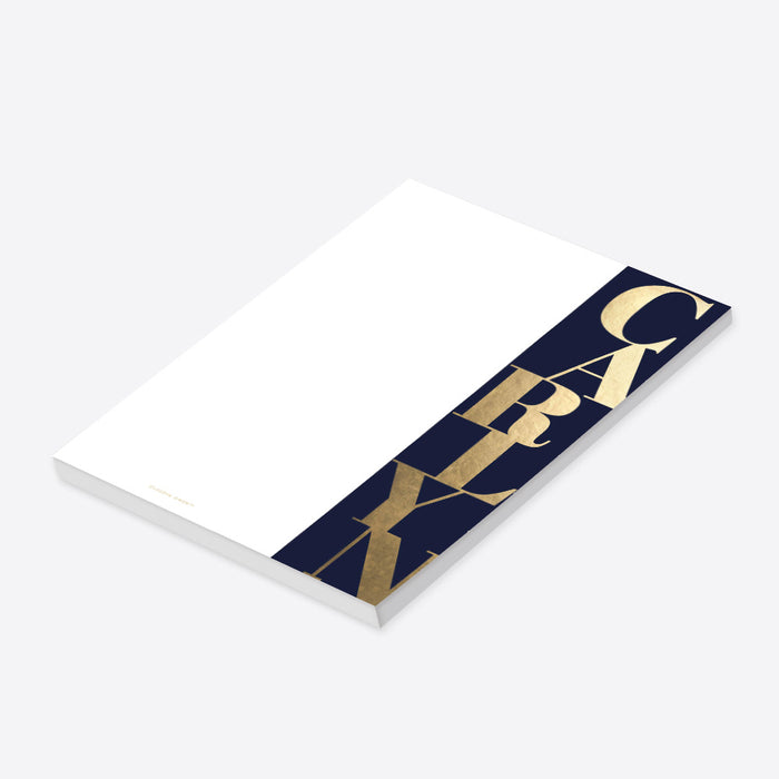 personalized navy and gold notepad with bold vertical lettering, custom name, and clean white writing space-side