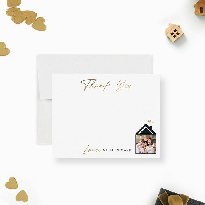 Personalized note card with thank you wording, personalized names and couple portraits in a house illustration, shown with a white envelope.