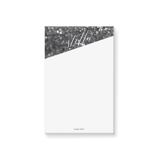 Personalized black and white notepad with bokeh design, name in elegant script lettering, and blank writing area