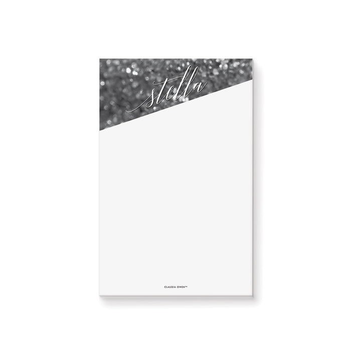 Personalized black and white notepad with bokeh design, name in elegant script lettering, and blank writing area