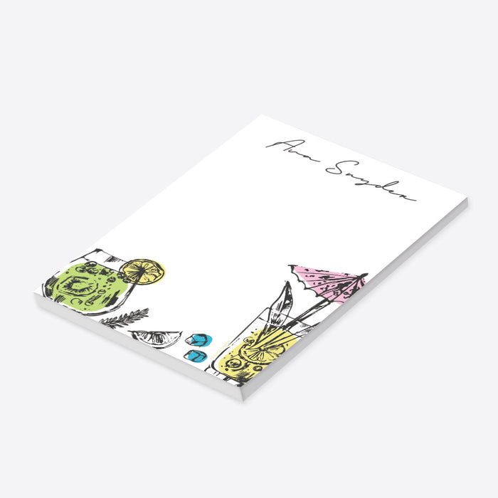 Personalized cocktail notepad with hand-drawn fruity drink illustrations, lemon slice, kiwi, herbs, ice cubes, and pink umbrella, customized with name.-side