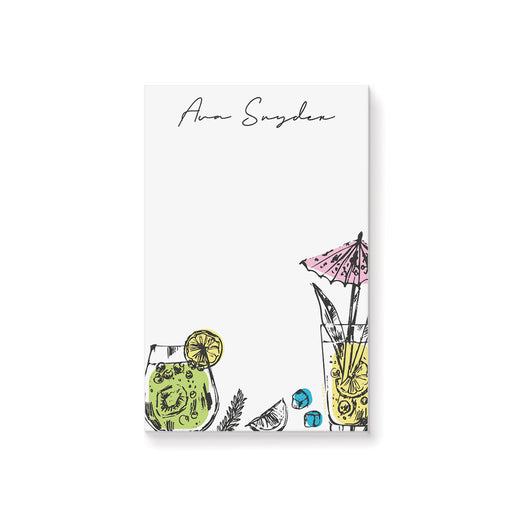 Personalized cocktail notepad with hand-drawn fruity drink illustrations, lemon slice, kiwi, herbs, ice cubes, and pink umbrella, customized with name.