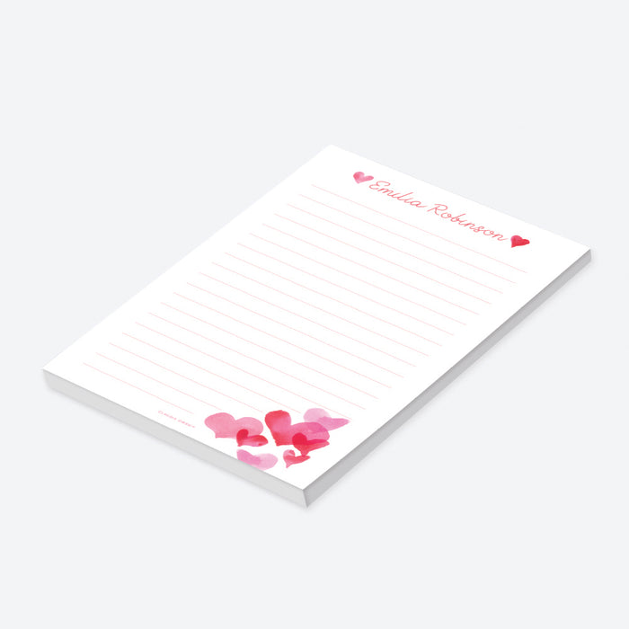 Personalized notepad featuring a soft watercolor hearts in pink and red-side