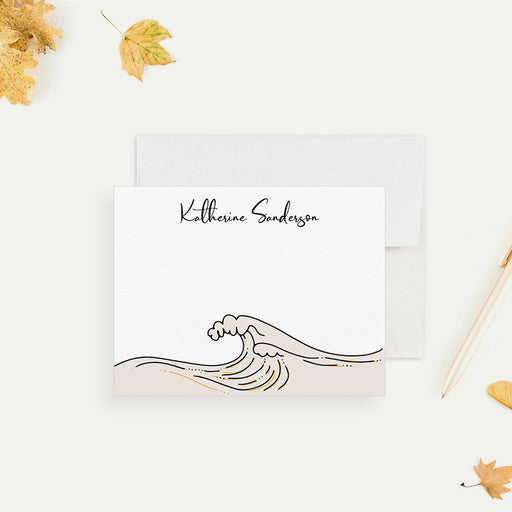 Personalized note card with a wave line drawing and a personalized name, shown with a white envelope.
