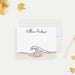 Personalized note card with a wave line drawing and a personalized name, shown with a white envelope.