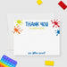 Personalized note card with colorful paint splashes, thank you wording and a personalized name, shown with a white envelope.