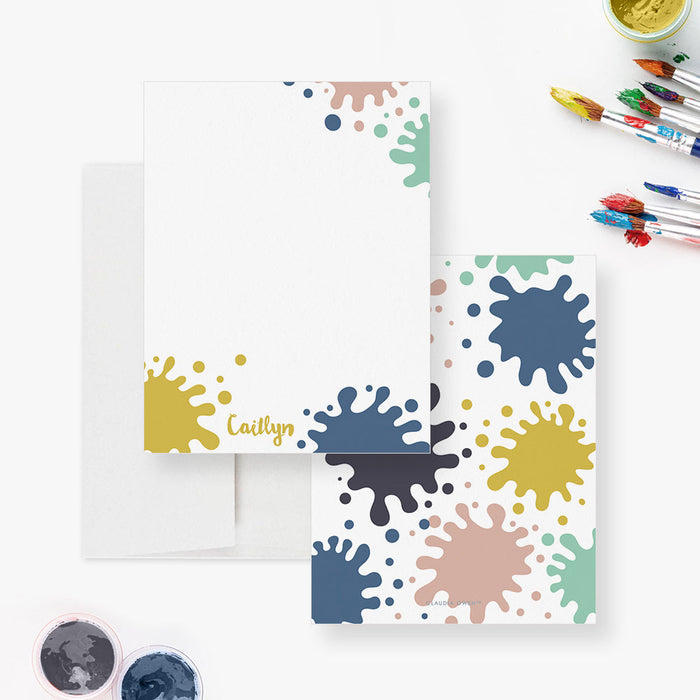 Front and back of personalized note cards with colorful paint splatters around a white writing area and a colorful paint splatter patterned back.